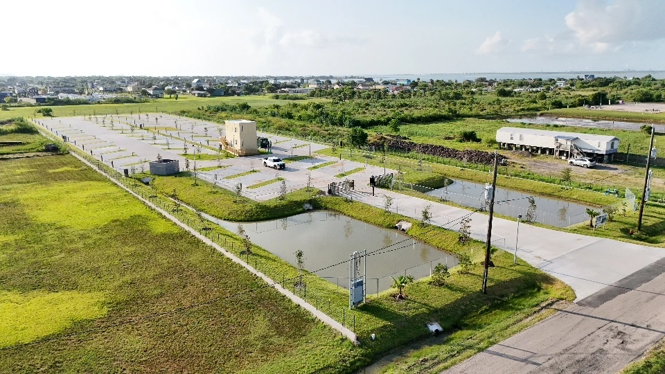 Aerial view of the park with retention ponds and Galveston Bay on the horizon